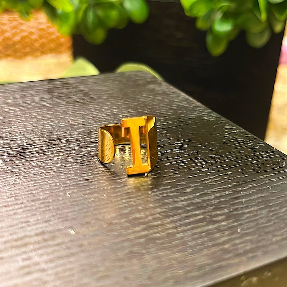 Brand new One Size  fits all stainless steel “I” initial ring. Adjustable.